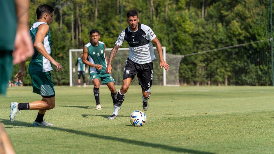 defenders surrounding attacker soccer
