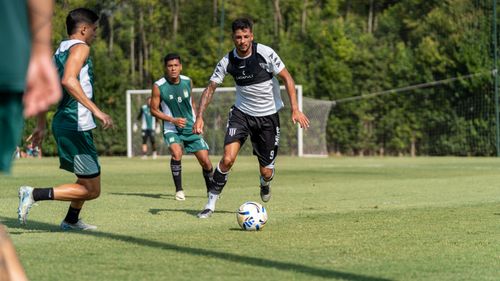 Free Players in action during an outdoor soccer match, showcasing athletic skills. Stock Photo