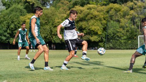 Free Dynamic action shot of soccer game capturing players in motion on a sunny day. Stock Photo