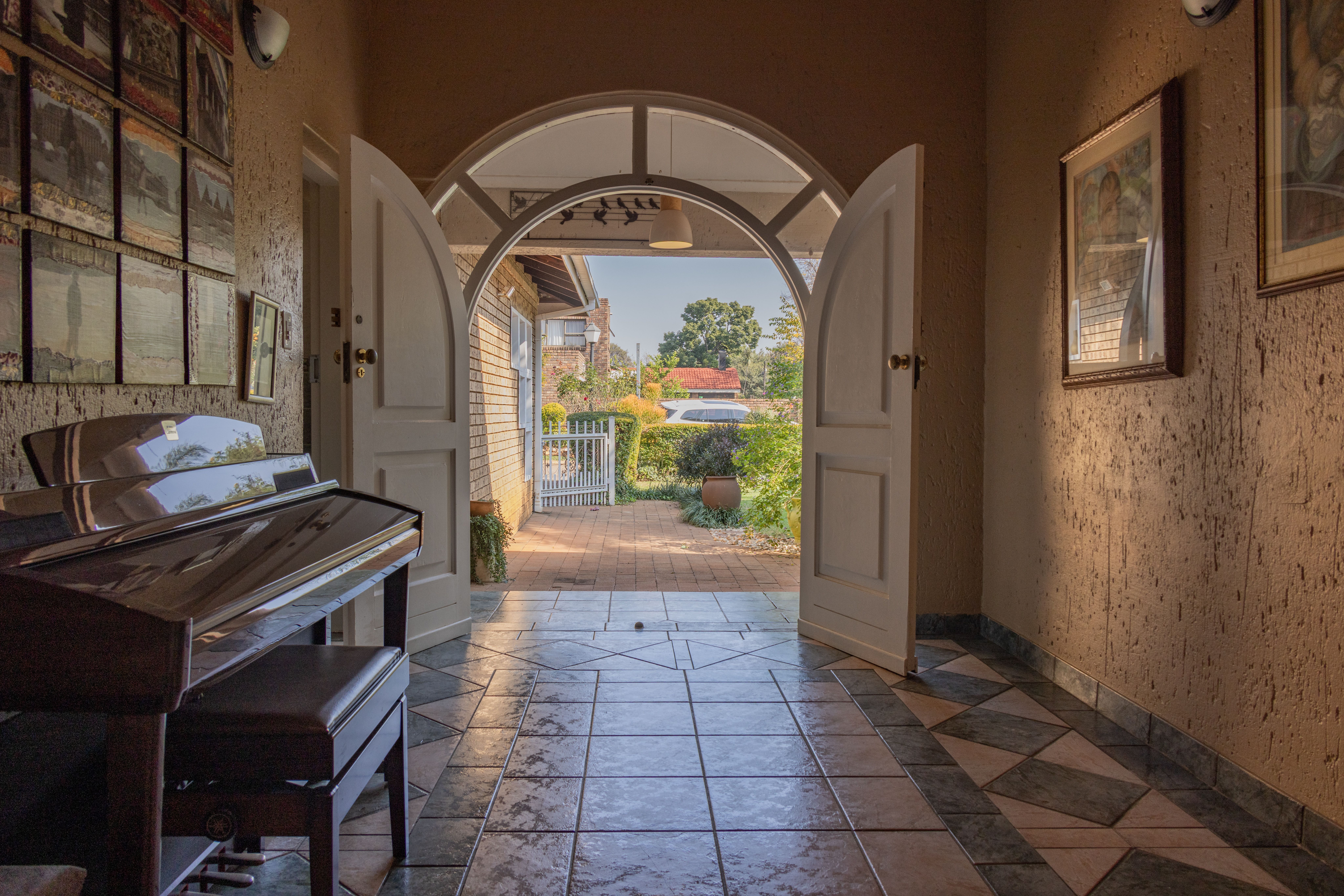 Bright entryway of a home with open door and natural light welcoming visitors