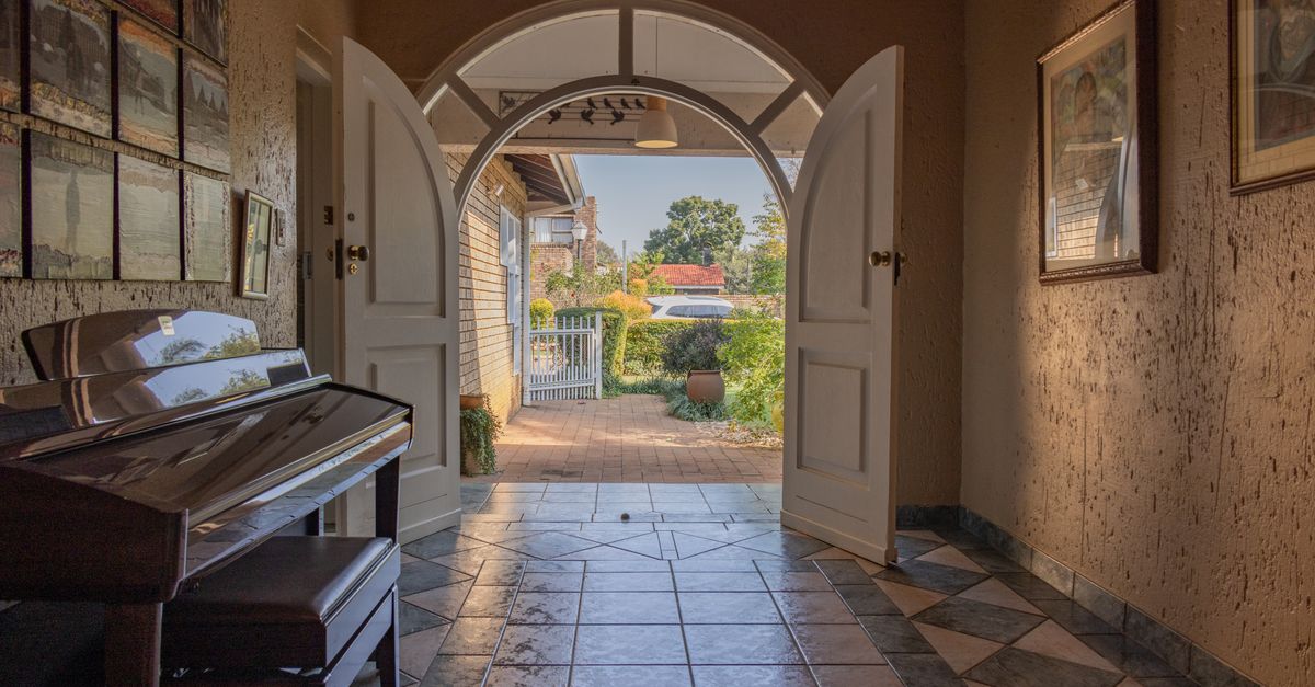 Bright entryway of a home with open door and natural light welcoming visitors