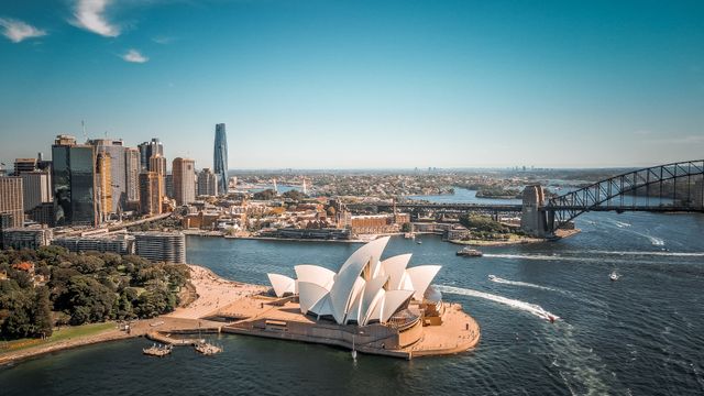 Australia, Breathtaking aerial view of Sydney Opera House with surrounding skyline and Harbor Bridge.