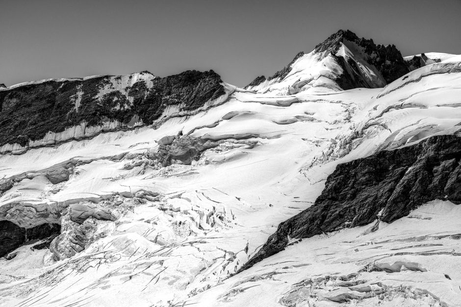 A breathtaking view of the Jungfrau snow-capped peaks in monochrome elegance.