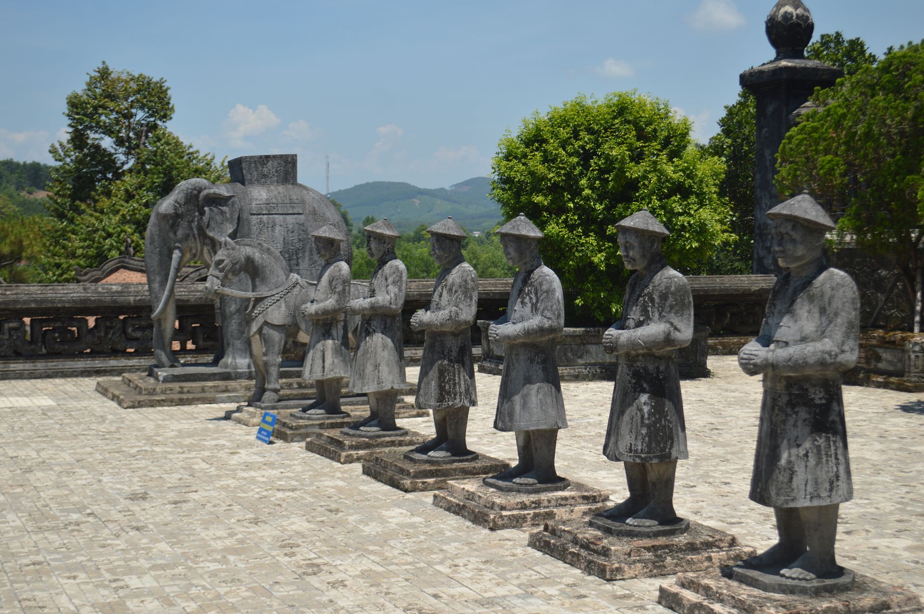 Stone statues at Khai Dinh Tomb, Huế, Vietnam on a sunny day.