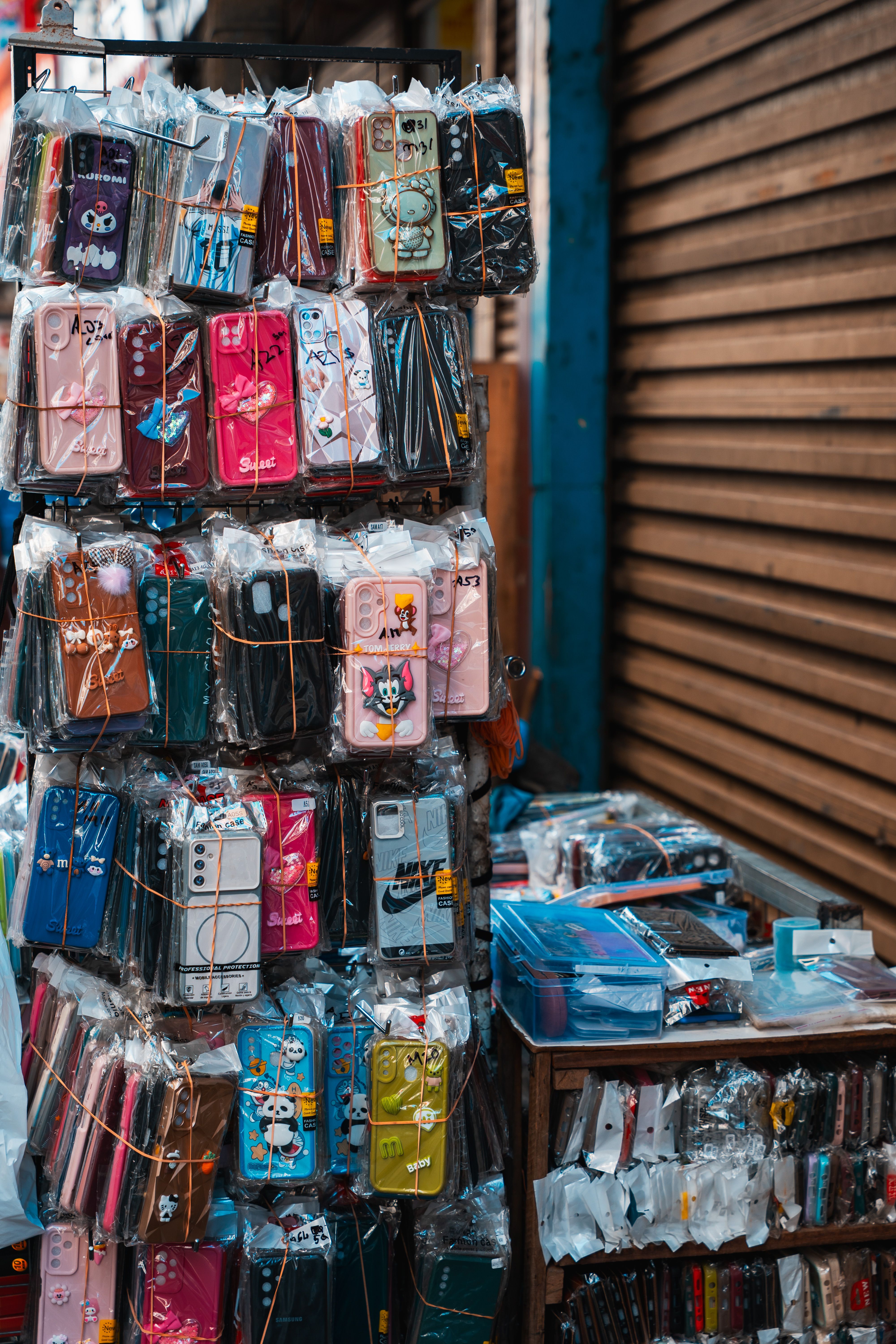 Colorful mobile phone accessories on display at a street market in Colombo, Sri Lanka. - Identifying Quality Products vs. Counterfeits