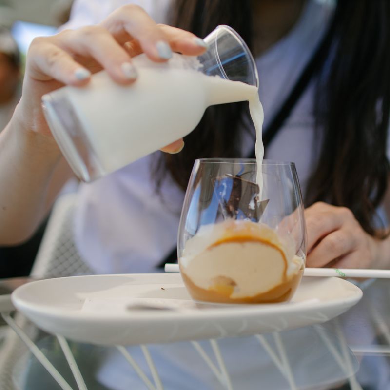 Milk poured into a coupe glass — photo by Jay Moon on Pexels