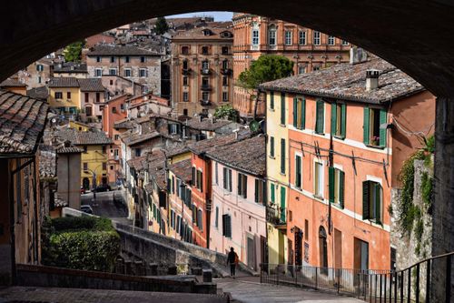 Free Explore the vibrant architecture and historic charm of Umbria's old town streets. Stock Photo