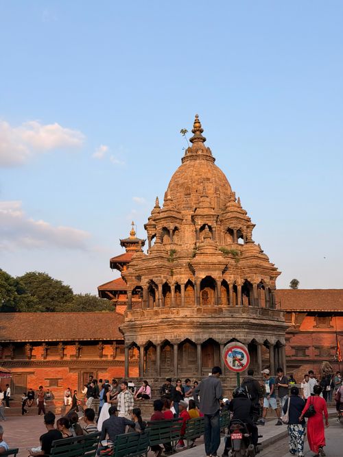 Free Bustling Patan Durbar Square captures the historic temple architecture and vibrant street life of Nepal. Stock Photo