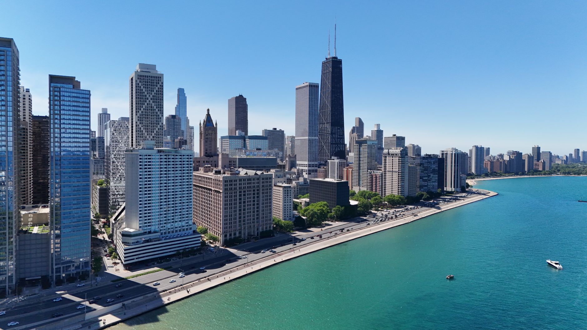 Discover Chicago's skyline with the John Hancock Center and Lake Michigan's vibrant shore.