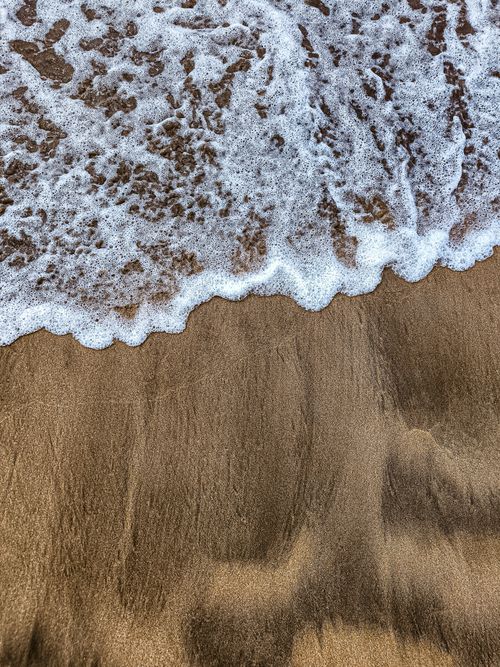 Free Capture the soothing rhythm of waves lapping a golden sand beach in Casablanca, Morocco. Stock Photo
