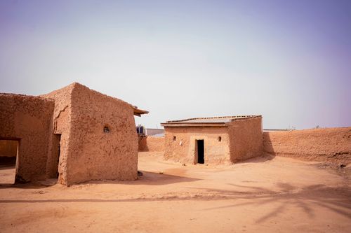 Free Rustic clay houses under a clear sky in a rural area of KT, Nigeria, showcasing traditional architecture. Stock Photo