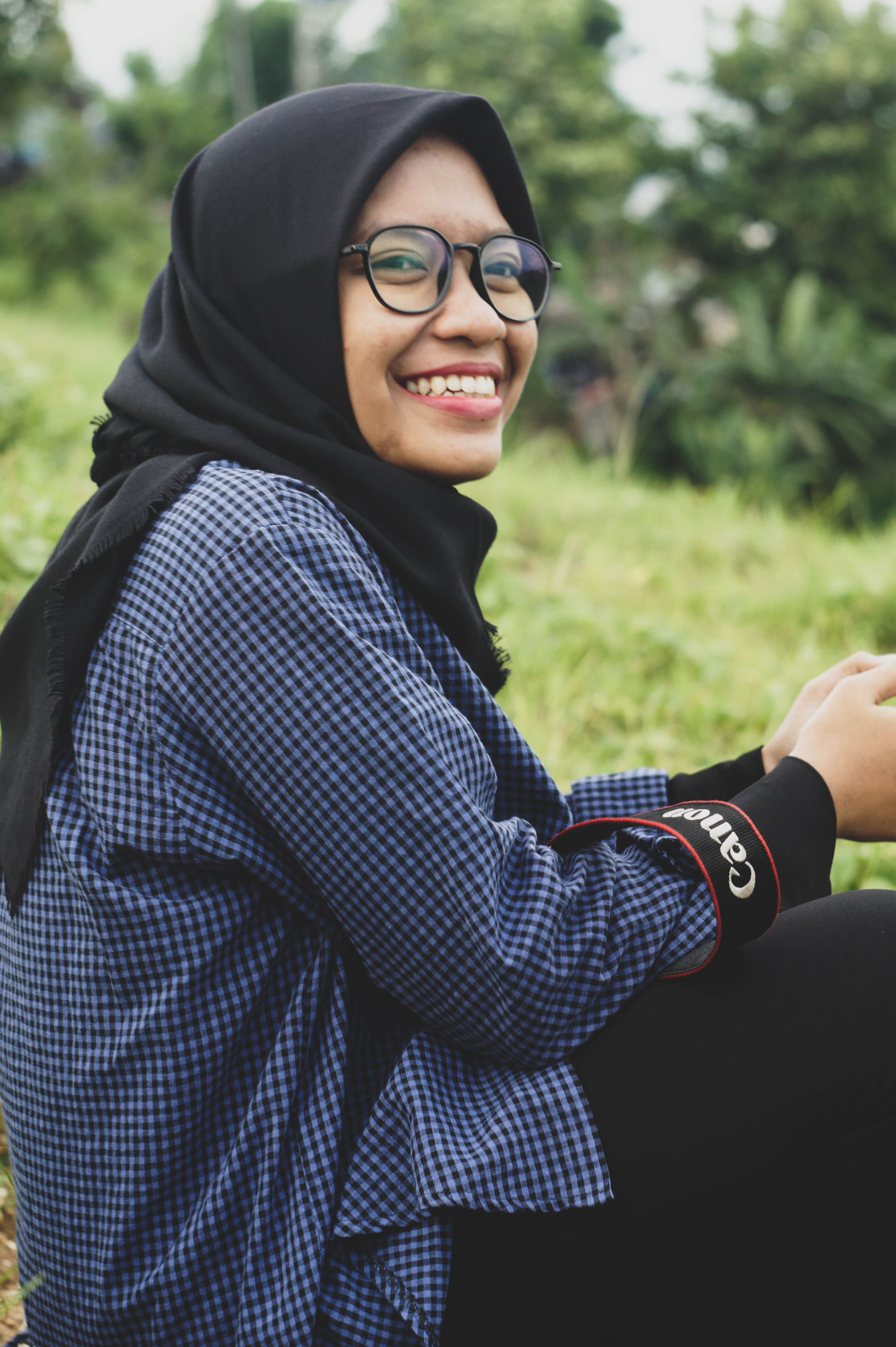 Woman in Black Hijab and Checkered Long Sleeve Shirt · Free Stock Photo