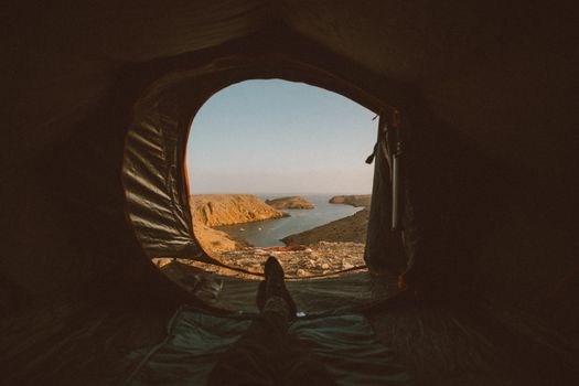 Enjoy a scenic view of the Oman coastline from a cozy tent in Muscat during a camping trip.