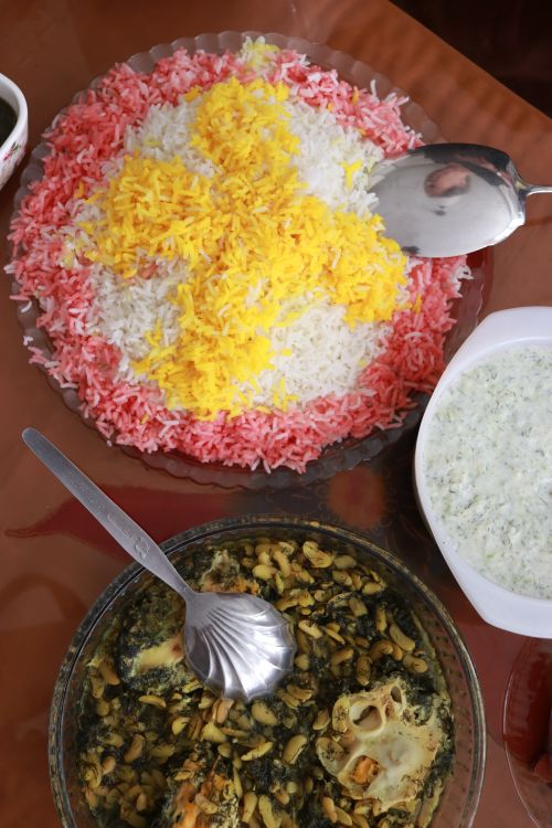 Free A vibrant Persian dish featuring colorful saffron rice and herb stew, perfect for culinary enthusiasts. Stock Photo