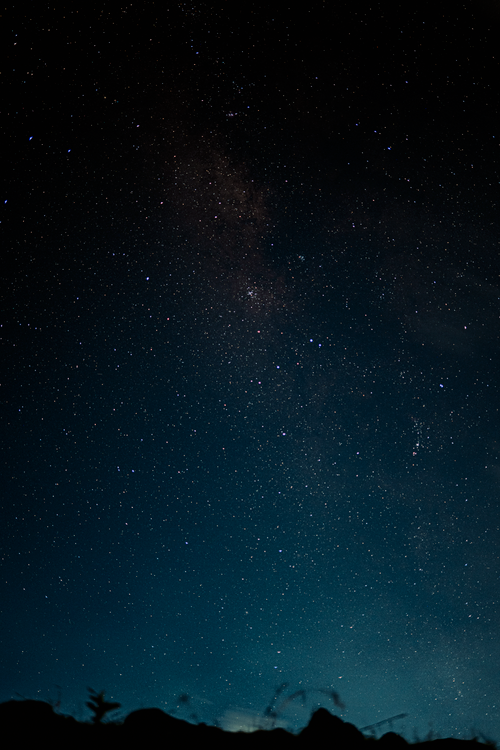 Free Starry night sky with Milky Way visible over the Phu Quy landscape in Vietnam. Stock Photo