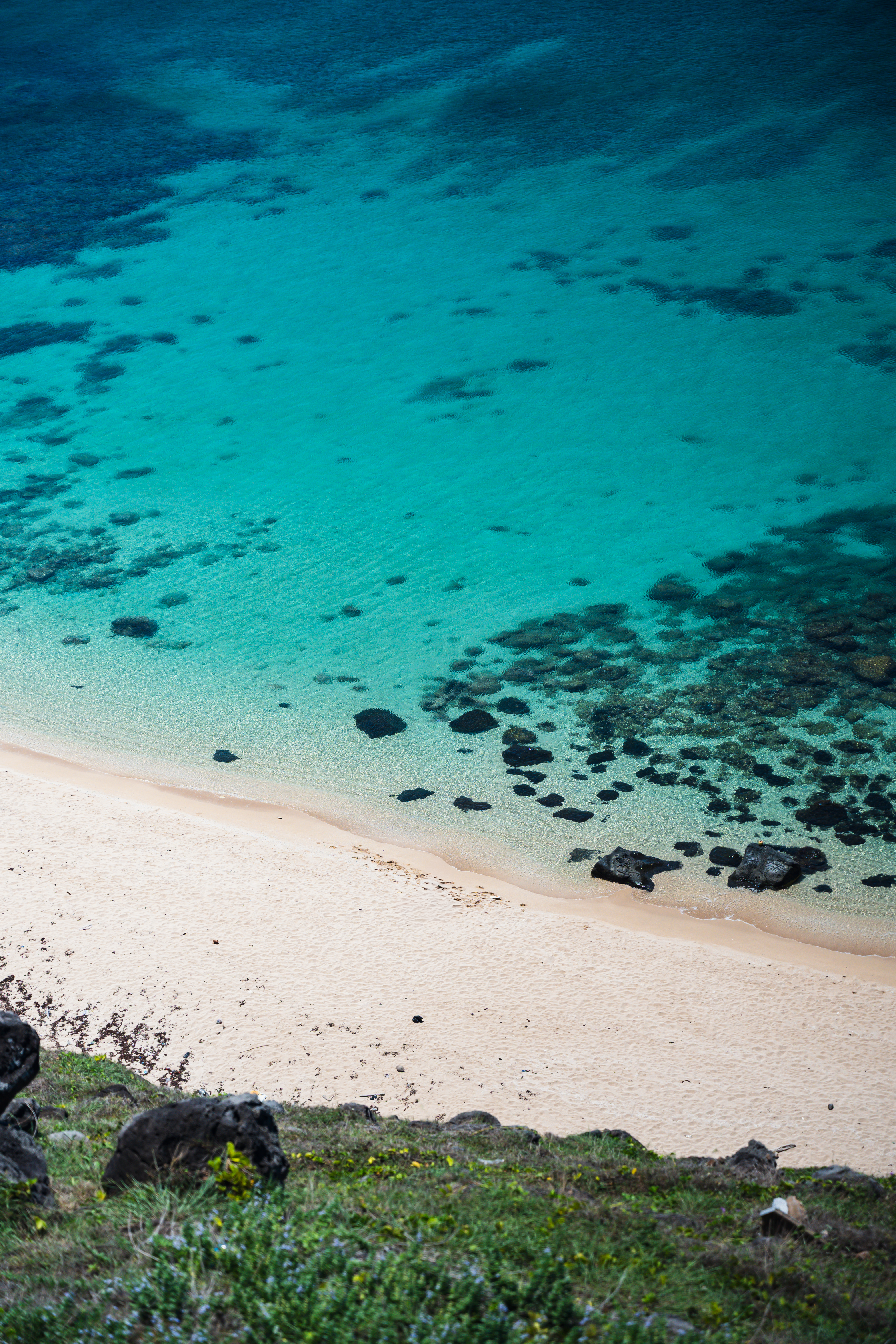 Aerial view of turquoise waters and sandy beach on Phu Quy Island, Vietnam.