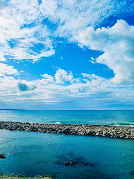 Stunning view of the Black Sea coastline with rocks and clear blue skies above.