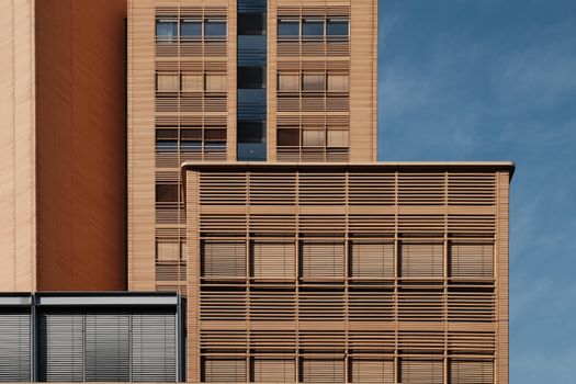 Close-up of a modern building facade in Berlin, showcasing geometric patterns and textures.