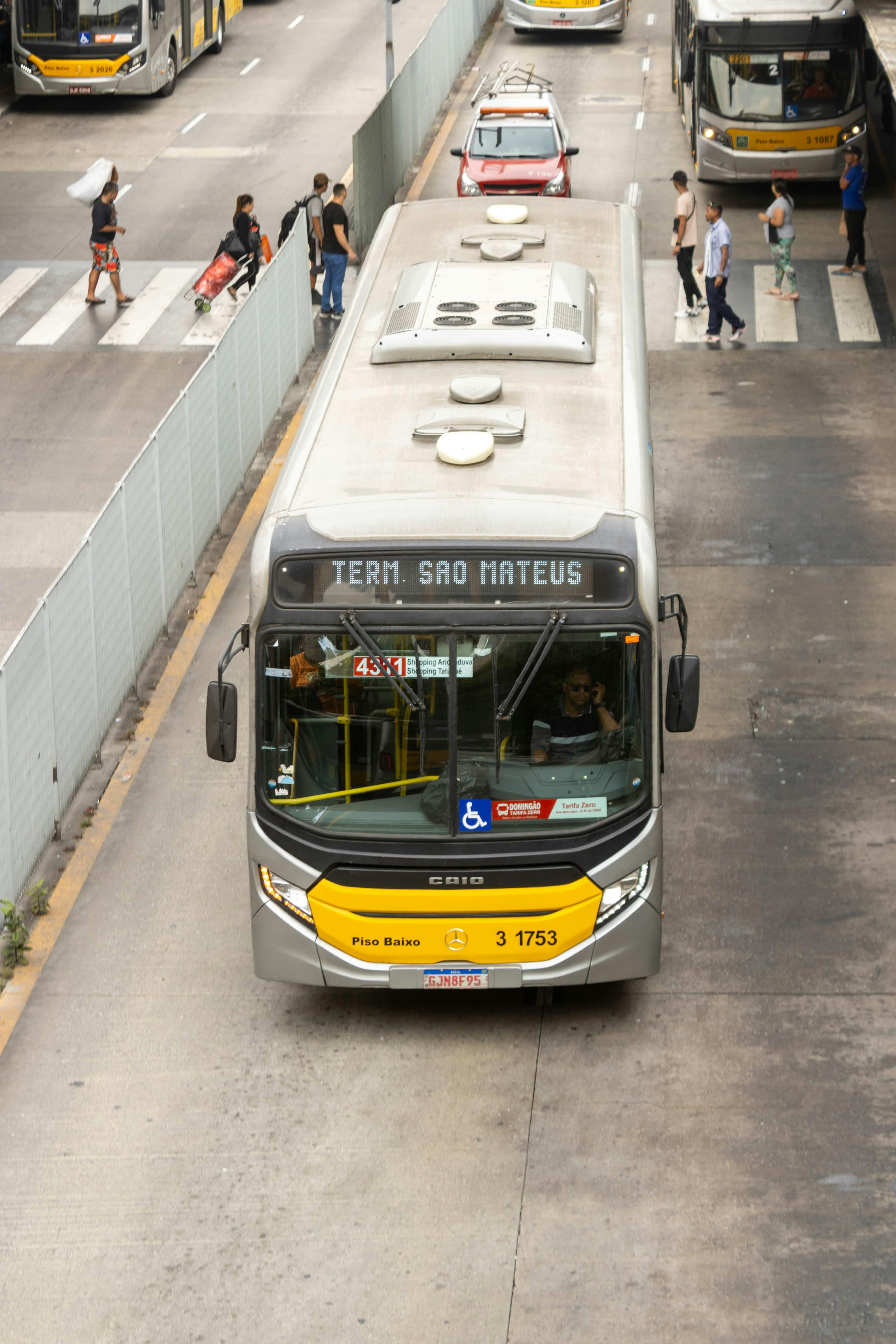 A busy city street with buses and pedestrians in Sao Paulo, Brazil.