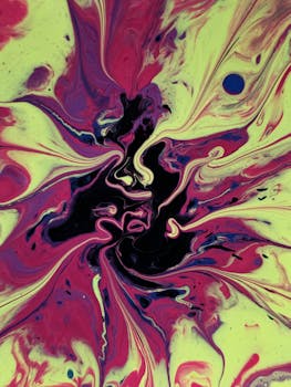 Vivid abstract fluid art with swirling colors creating a dynamic visual effect. Perfect for backgrounds.