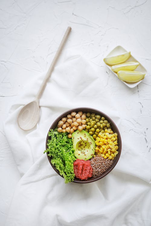 Free Brown Wooden Spoon Beside Ceramic Bowl Stock Photo