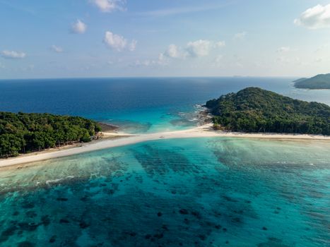 Breathtaking aerial photo of Cinque Island's turquoise waters and lush landscape in India.