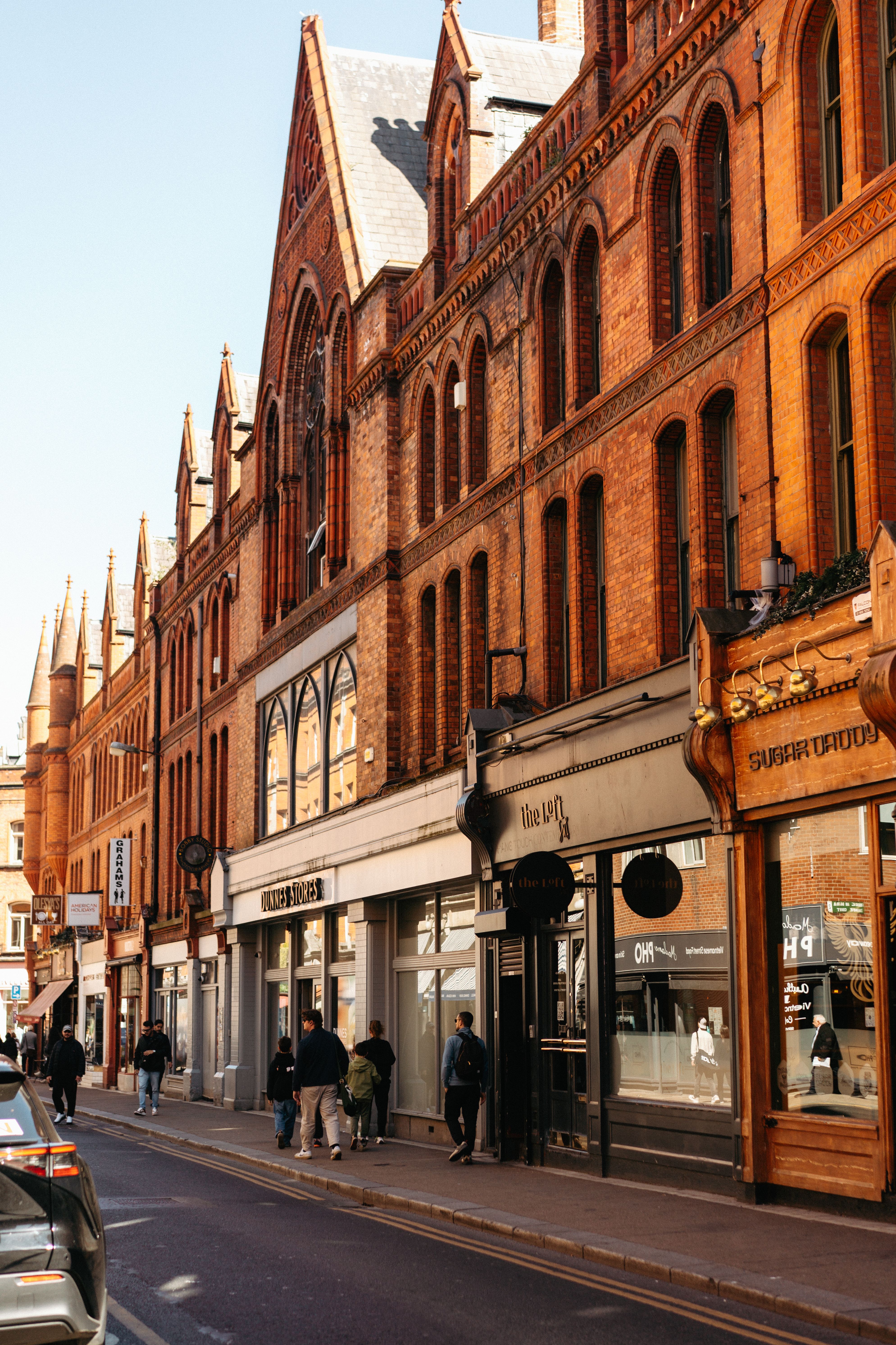 Vibrant European Street Scene with Red Brick Architecture · Free Stock ...