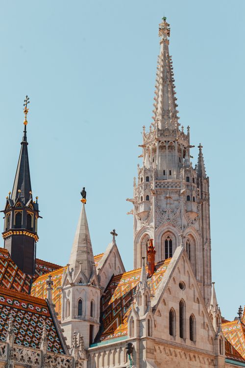 Free The intricate spires of Matthias Church in Budapest stand tall under a clear sky. Stock Photo
