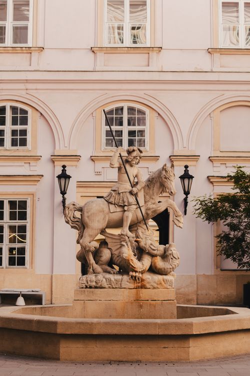 Free Antique stone statue of a warrior on horseback in a Bratislava courtyard, Slovakia. Stock Photo