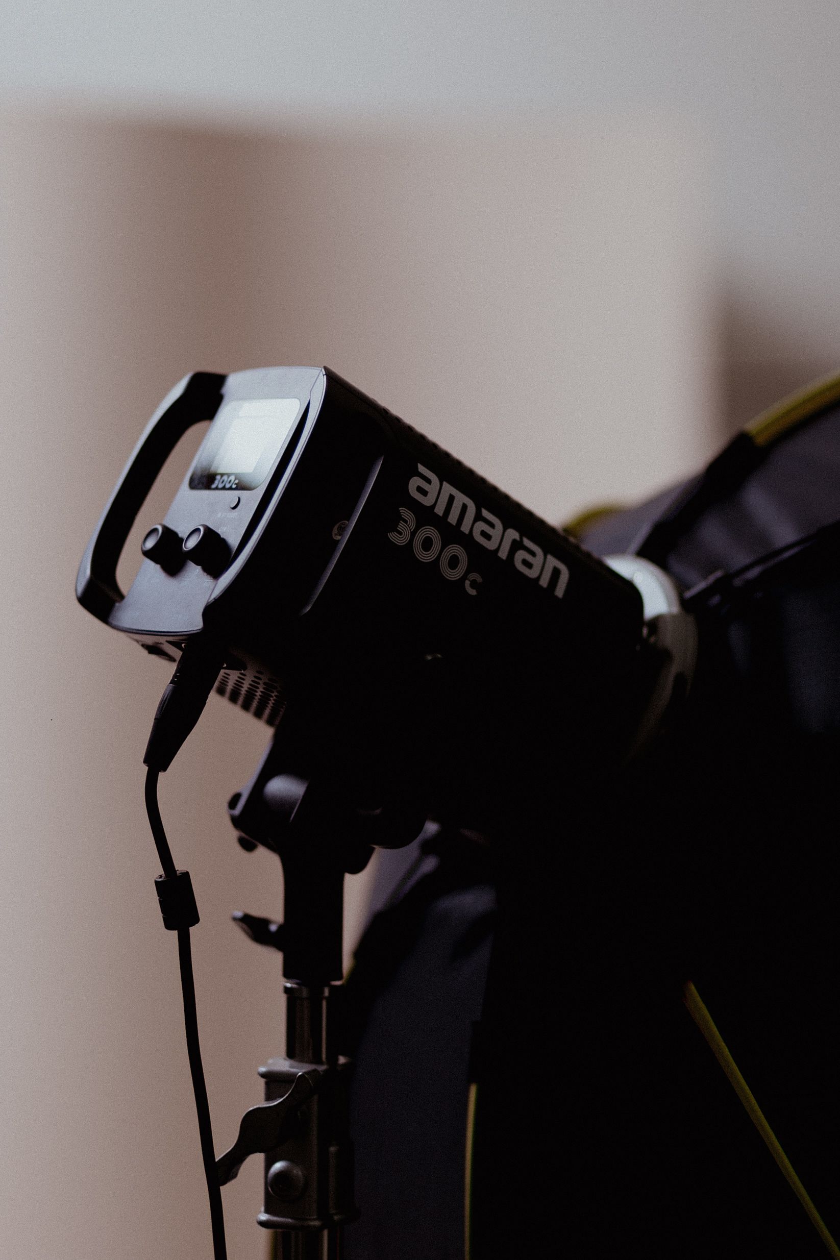 Close-up of a studio lighting setup featuring an Amaran light for professional photography.