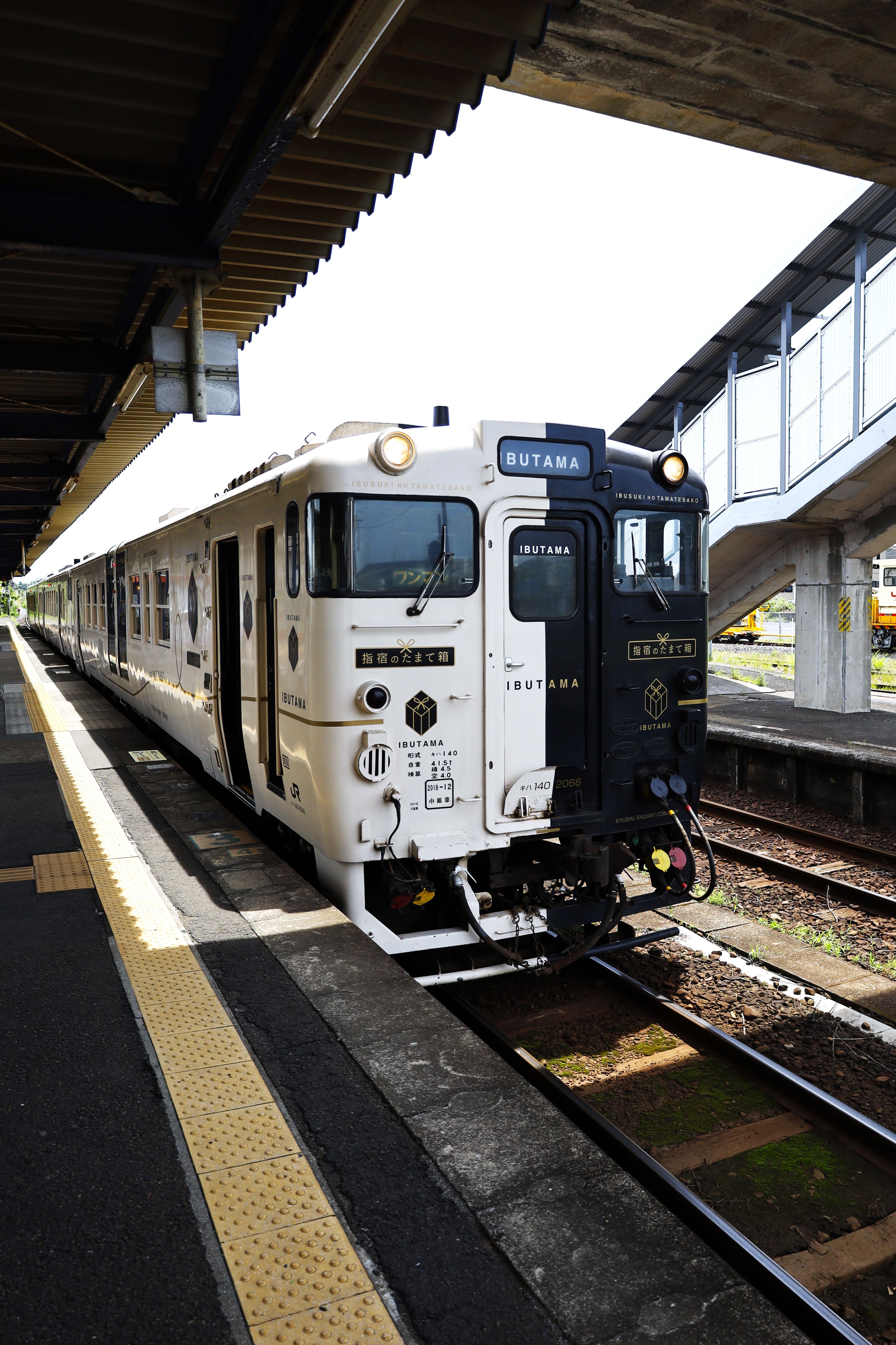 Elegant white and black train on platform at Ibusuki Station, Kagoshima, Japan. Perfect travel experience.