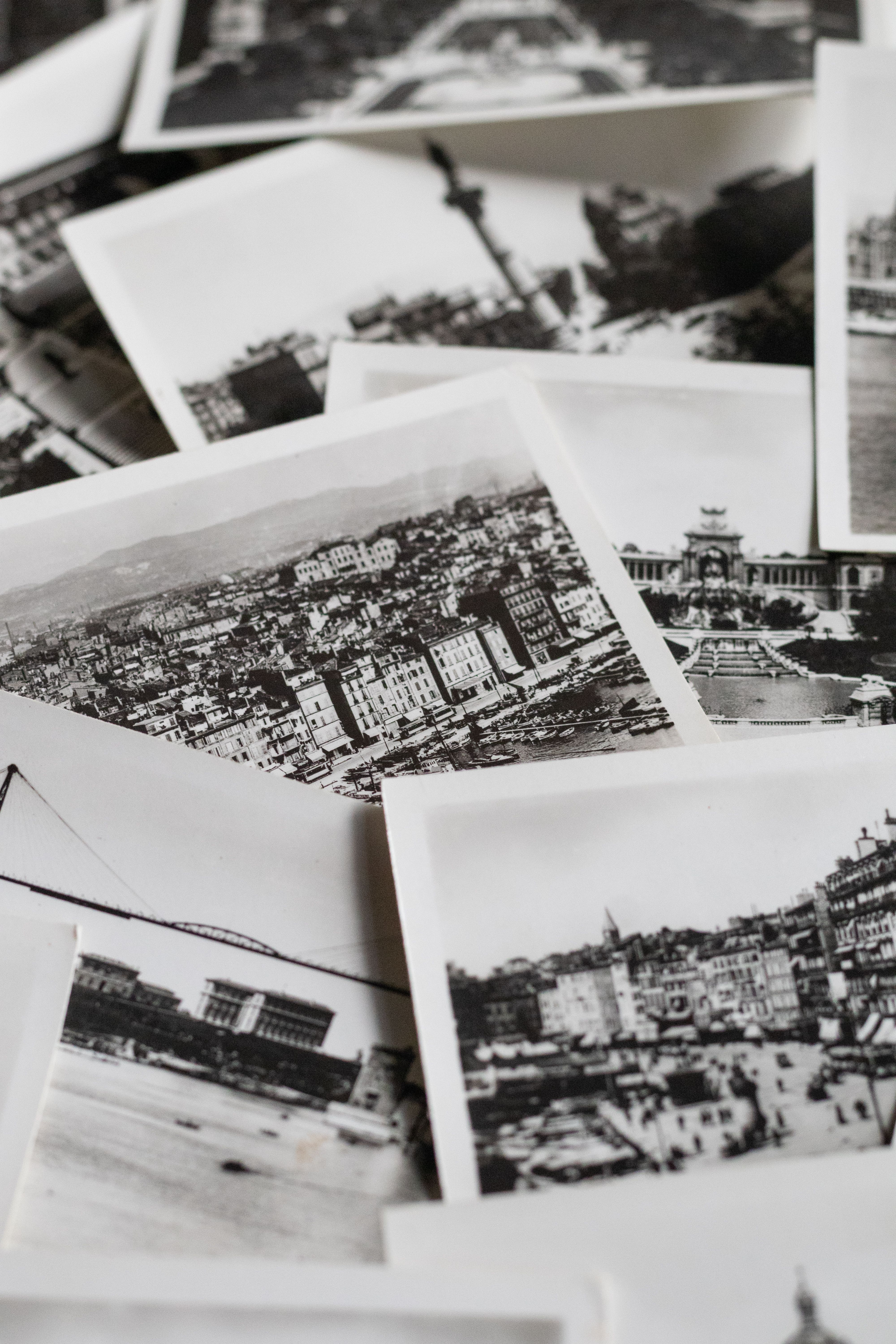Black and white vintage postcards depicting European landmarks, offering a nostalgic glimpse into the past.
