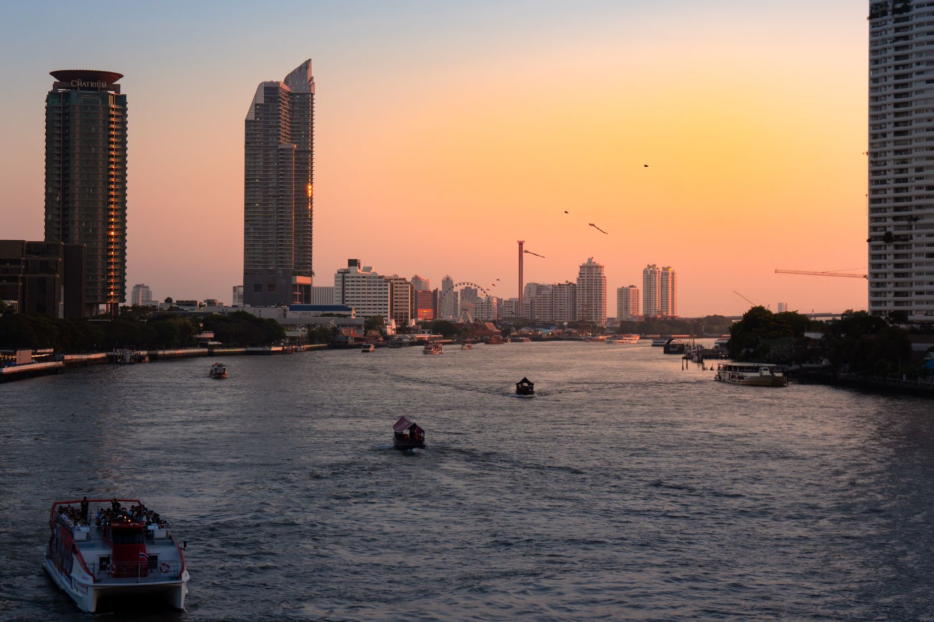 Panoramic view of Bangkok skyline and river at sunset