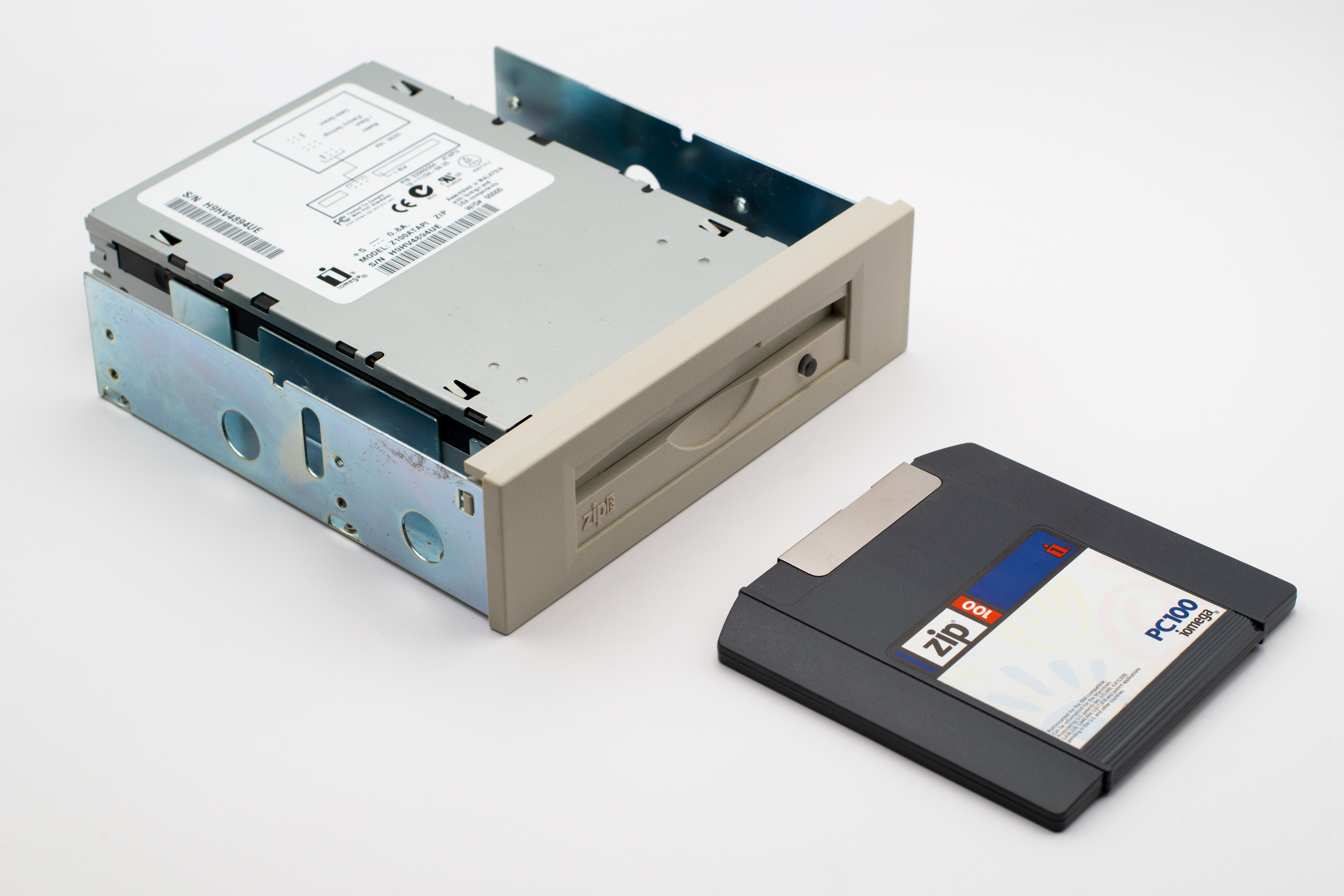 Retro Zip drive with a Zip diskette, highlighting old computer storage technology.