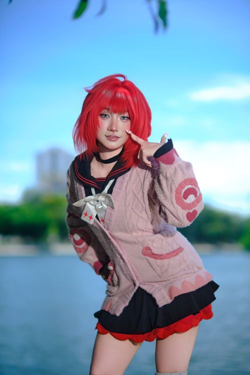 Free Vibrant cosplay portrait with red-haired character by a lake. Stock Photo