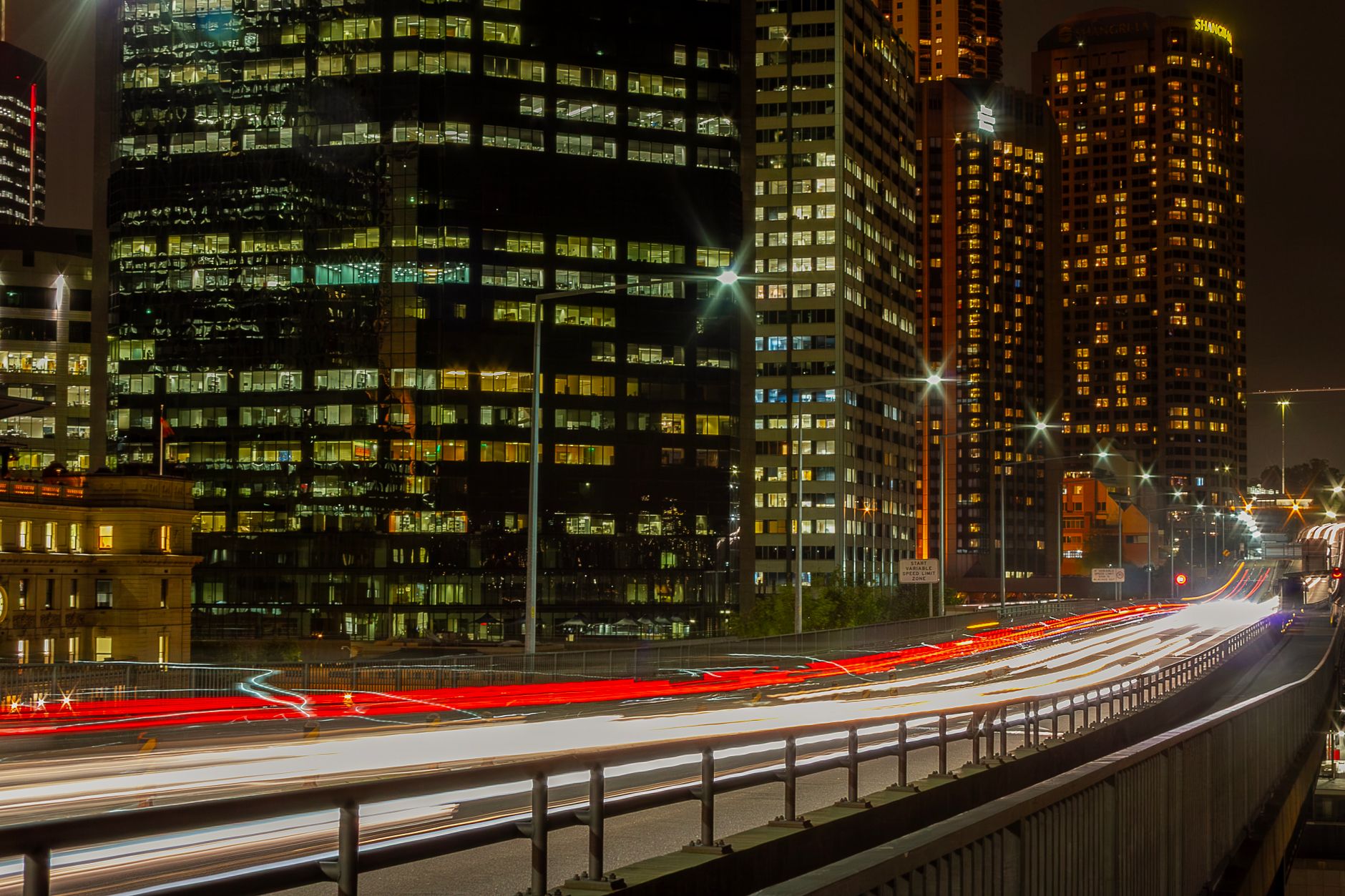 Captivating long exposure of Sydney's city lights and architecture at night.