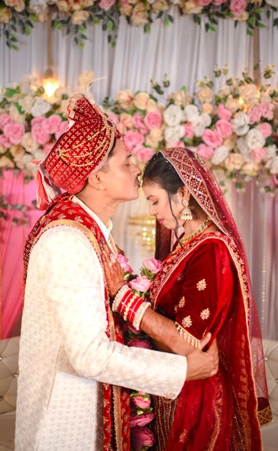 Captivating moment of an Indian couple embracing on their wedding day.