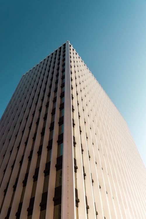 White Concrete Building Under Blue Sky