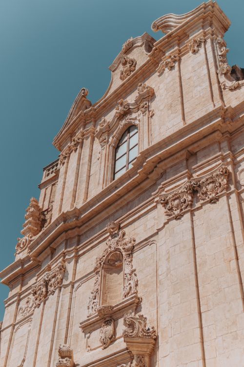 Free Stunning Baroque architecture in Ostuni, showcasing intricate design under a clear blue sky. Stock Photo