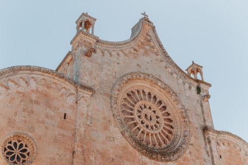 Free Captivating view of Ostuni Cathedral's intricate gothic facade in Apulia, Italy. Stock Photo