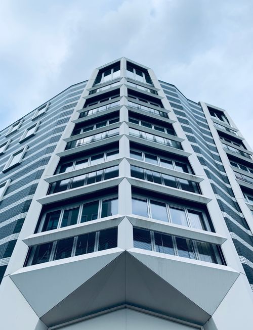 Free Low angle view of a geometric high-rise building in Zaandam, Netherlands under a cloudy sky. Stock Photo