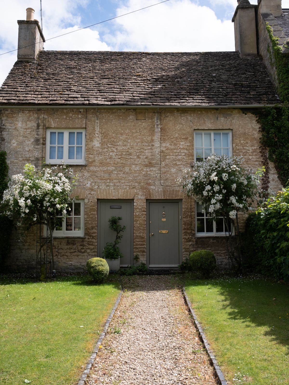 A honey-stone cottage in a Cotswolds village