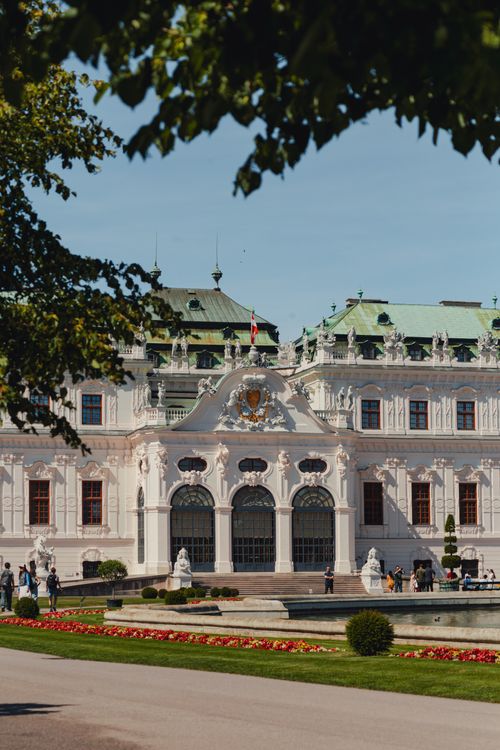 Free Beautiful view of the historic Belvedere Palace in Vienna, surrounded by lush gardens. Stock Photo