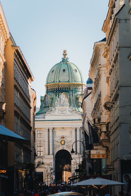 Free Captured view of Hofburg Palace's dome amidst Vienna's lively streets, showcasing classic architecture. Stock Photo