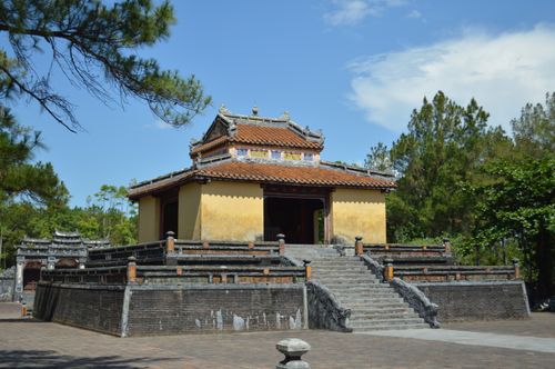 Free Ancient Vietnamese temple featuring traditional architecture and vibrant surroundings. Stock Photo