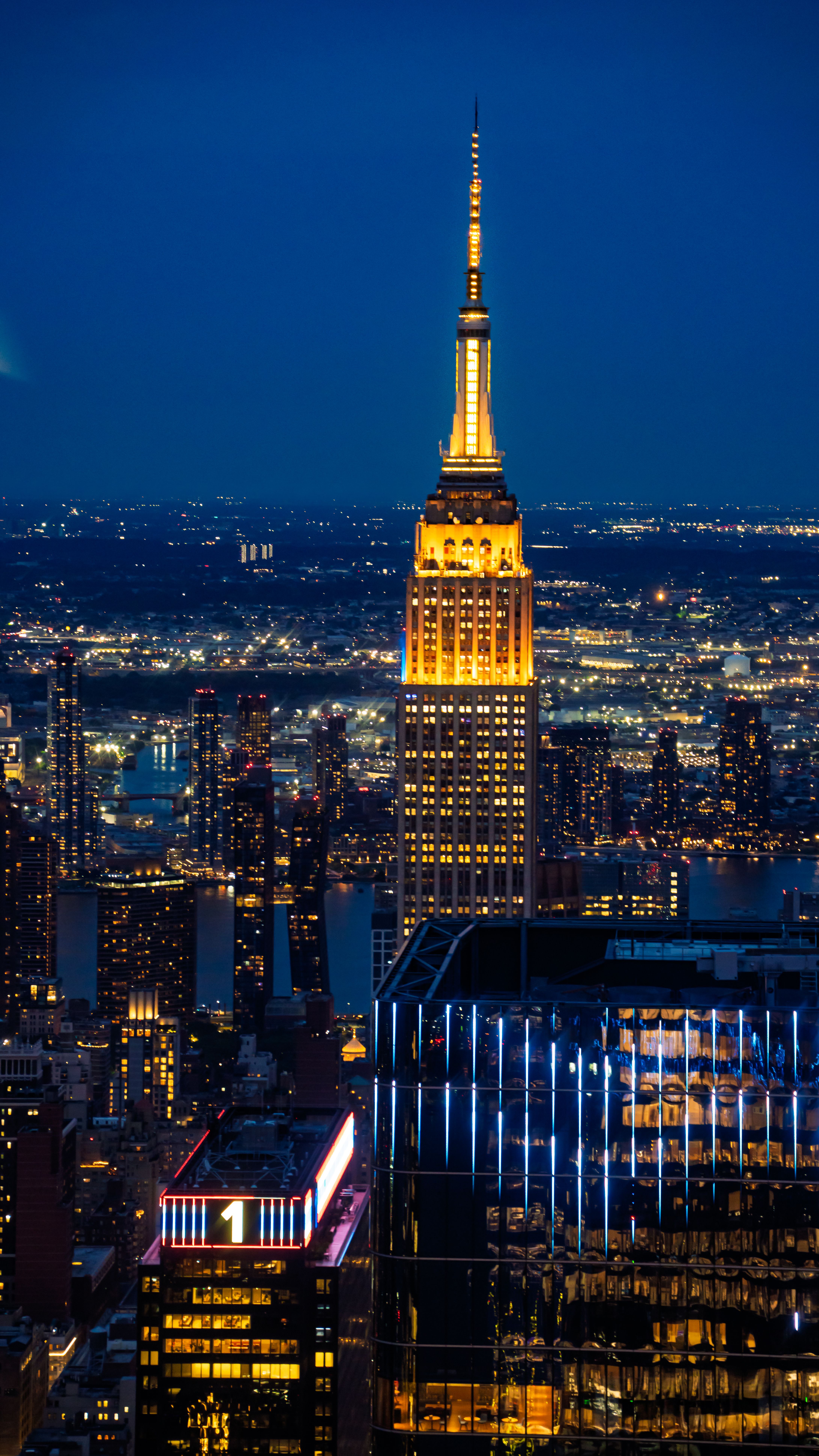 The Empire State Building and Skyline of New York City at Night · Free ...
