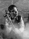 Monochrome Photo of Woman Holding Hammer
