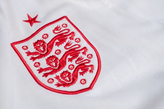 Detailed look at the England national football team's emblem on a jersey.