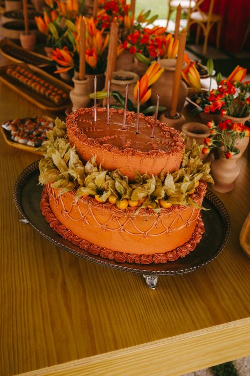 Free Exquisite terracotta cake adorned with candles and decorative elements, perfect for wedding celebrations. Stock Photo