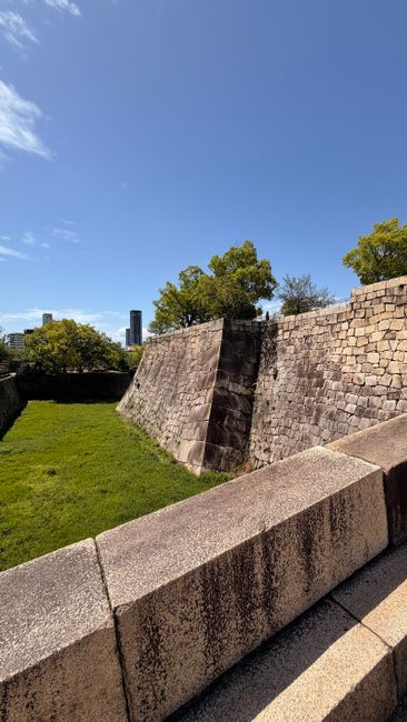 Captivating scene of the stone fortifications in Ōsaka Castle Park, showcasing historical architecture.